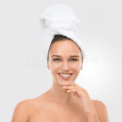 Buy stock photo Portrait, woman and smile with head towel for skincare, wellness and beauty on light grey background. Happy, female person and laugh with glow for self care, dermatology and spa treatment with mockup