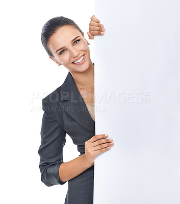 Buy stock photo Studio shot of an attractive young businesswoman holding a blank placard for copyspace