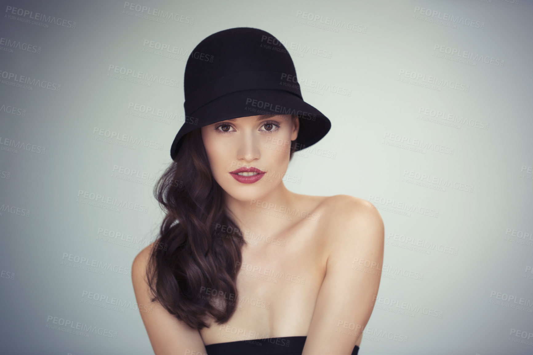 Buy stock photo Fashion, makeup and portrait of woman with hat in studio for wellness, treatment and glowing skin on grey background. Style, beauty or female model with elegance, confidence or posing in red lipstick