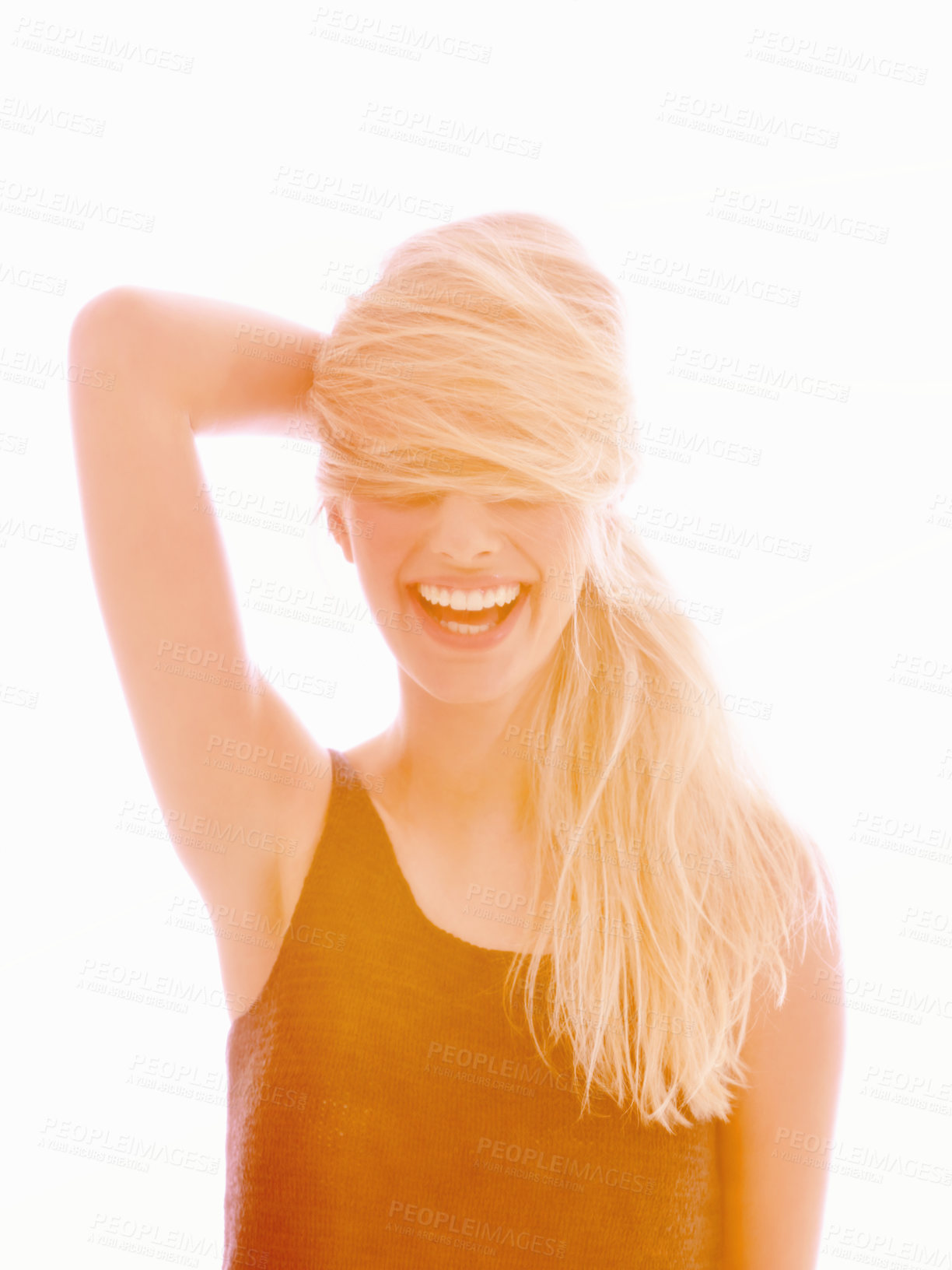 Buy stock photo A young woman laughing with her hair covering her eyes