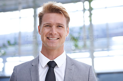 Buy stock photo Smile, portrait and businessman in office with ambition, positive and professional worker in formal suit. Sales manager, happy and face in closeup in corporate job, trust and company mission at work