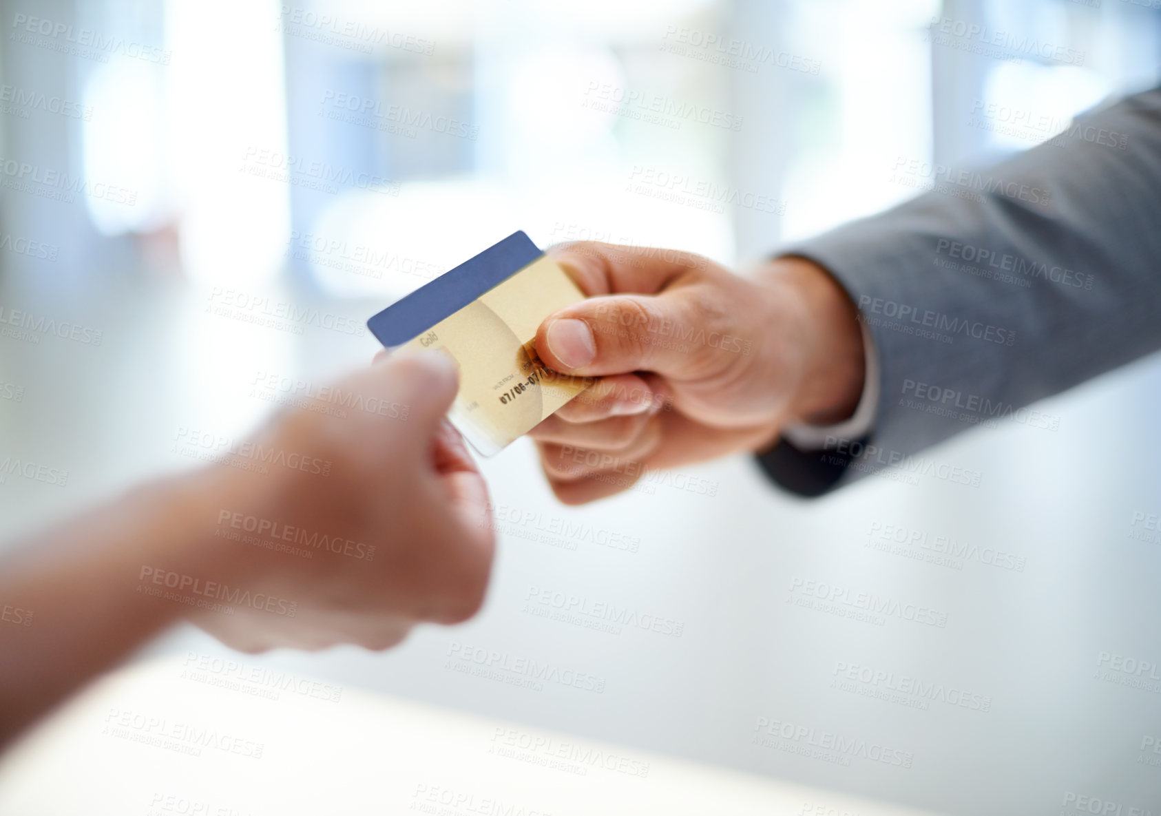 Buy stock photo Closeup cropped image of a man handing over a credit card to a woman