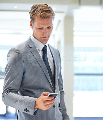 Buy stock photo Businessman, mobile app or research on social media, networking website or reading news in workplace. Check, chat or employee typing message on technology for schedule, internet or phone in office 