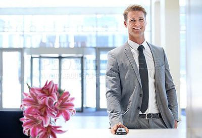 Buy stock photo Happy businessman, portrait and bell at reception desk for hotel reservation, stay or check in. Man or employee with smile in stylish business suit at counter for assistance, help or service at lodge