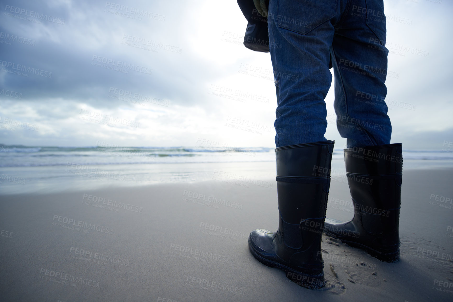 Buy stock photo Travel, boots and shoes of person at beach for ocean, tourism and walking in sand. Adventure, vacation and calm with feet of traveler and gumboots at seaside for relax, holiday trip and journey