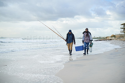 Buy stock photo Water, fishing and men walking on beach together with cooler, tackle box and holiday conversation. Ocean, fisherman and friends with rods, bait and tools at waves on winter morning vacation at sea.