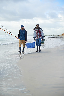 Buy stock photo Adventure, fishing and men walking on beach together with cooler, tackle box and holiday bonding. Ocean, fisherman and friends with rods, bait and tools at waves on winter morning vacation at sea.