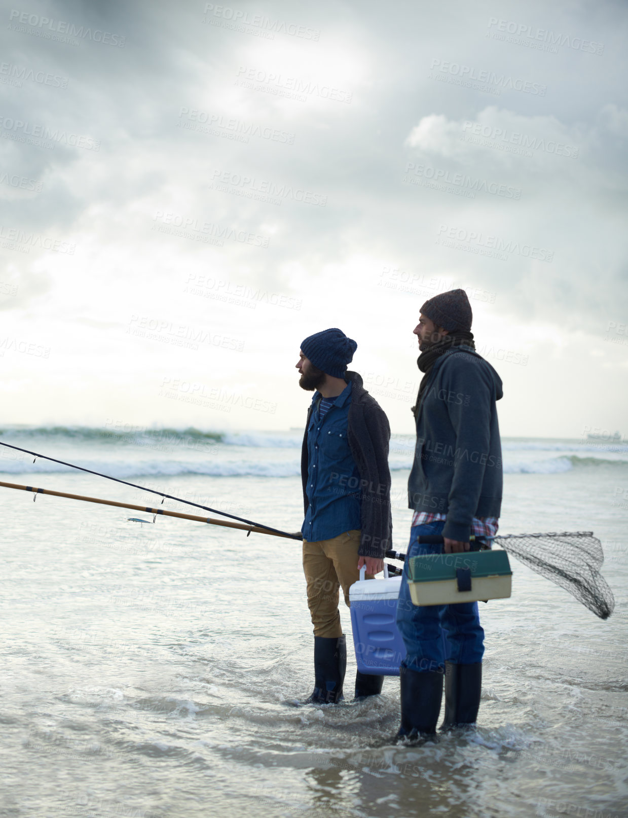 Buy stock photo Fisherman, friends and gear on beach for fishing in the morning by sea with overcast, equipment and sky. Friendship, men and net with bonding, travel or rod by water for hobby, holiday or activity
