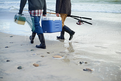 Buy stock photo Closeup, walking and beach with fishermen, cooler box and activity with equipment or weekend break. People, ocean or friends with tools for hobby or early overcast morning with waves, sand or seaside