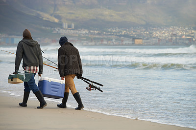 Buy stock photo Ocean, fishing and men walking at waves together with cooler, tackle box and holiday conversation. Beach, fisherman and friends with rods, bait and tools on winter morning vacation with mockup space