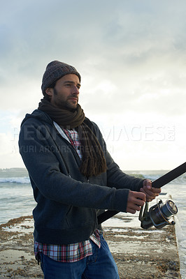 Buy stock photo Fishing, fisherman and man with gear by ocean for hobby with rod, reel and equipment to catch fish. Nature, sports and person cast a line for recreation or adventure on holiday, vacation and weekend