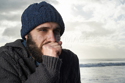 Buy stock photo Winter, breathing and ocean with man, thinking and cold weather with waves and freezing. Person, beach or guy with wool jersey or cap with early morning activity or nature with holiday, travel or sky