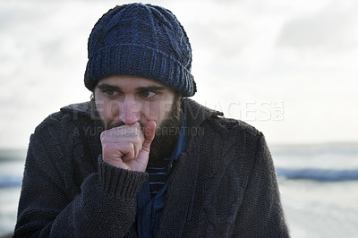 Buy stock photo Winter, breathing and beach with man, thinking and cold weather with waves and freezing. Person, ocean and guy with wool jersey and cap with early morning activity and nature with vacation and travel