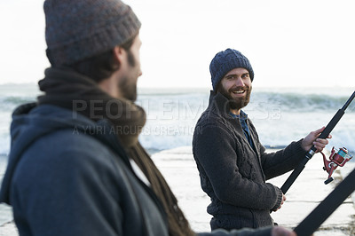 Buy stock photo People, fishing and friends at beach for hobby, relaxing and casting a line by ocean with gear. Men, fisherman and together on vacation or holiday, happy and bonding by waves and support on adventure