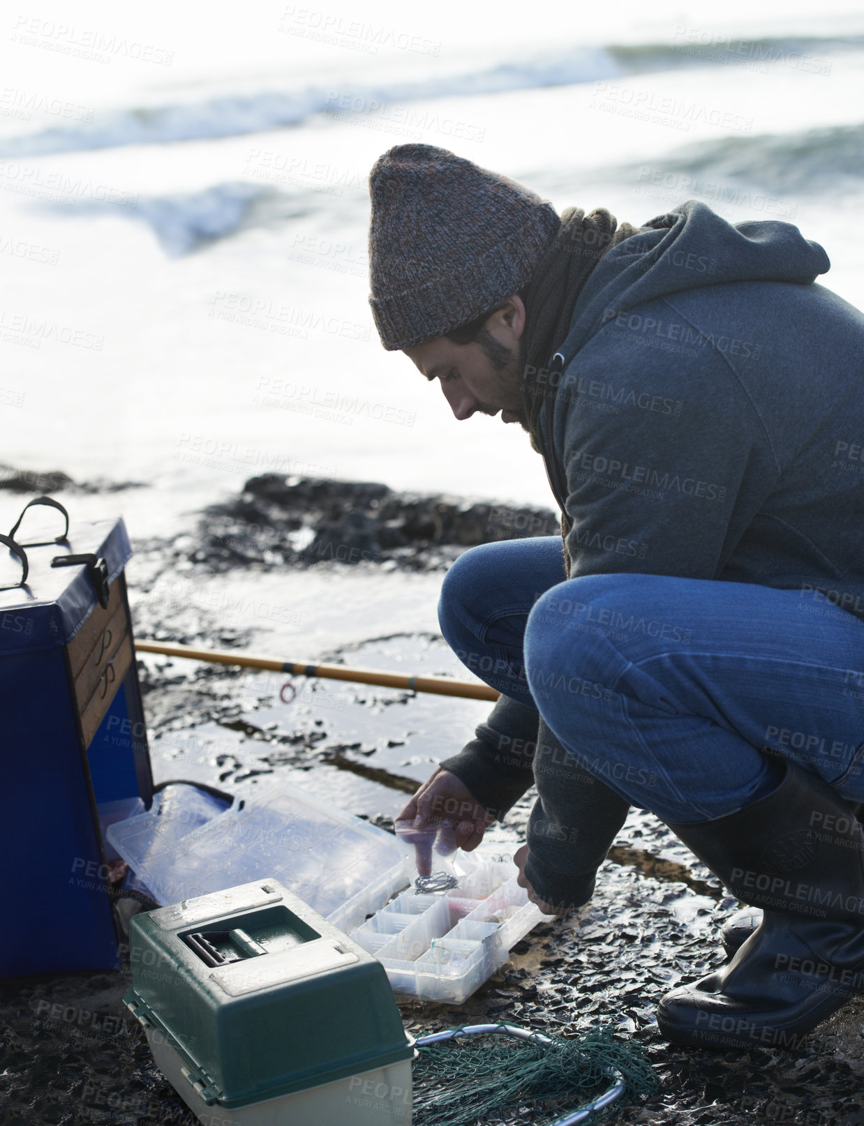 Buy stock photo Cold, gear and beach with fisherman, cooler box and hobby with equipment and weekend break. Person, ocean and guy with tools for activity and early morning with waves, shore and seaside with vacation