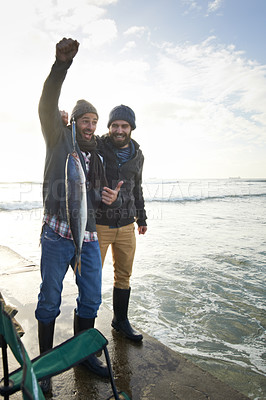 Buy stock photo Happy, surprise and people with fish at water with pride for catch of tuna on pier at sunset. Fishing, friends and fisherman smile with shock at success in nature at sea on holiday or vacation
