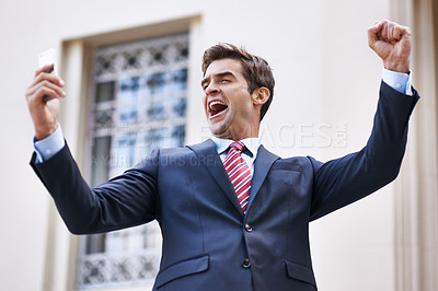 Buy stock photo Phone, celebration and excited businessman with winner fist in a city for competition, prize or giveaway. Smartphone, success and male lawyer with wow news, email or notification outdoor with victory