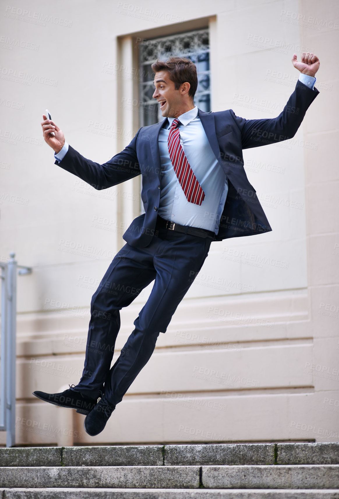 Buy stock photo Business, jump and excited man with phone in city street celebration for wow, news or winner fist gesture. Smartphone, energy or male entrepreneur with app alert for online competition prize or lotto