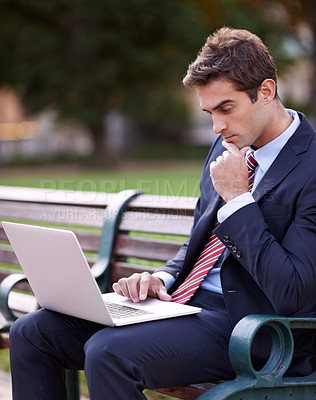 Buy stock photo Thinking, business man and laptop at park bench for opportunity, dream or vision for remote work. Computer, idea and consultant outdoor with decision, inspiration and serious employee planning future