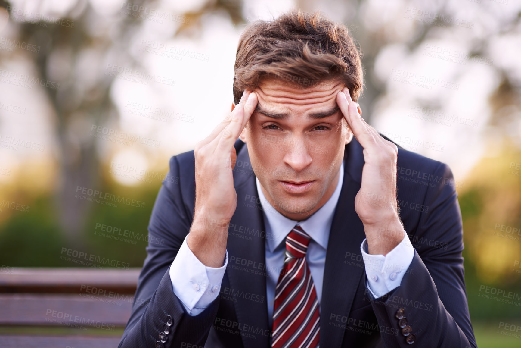 Buy stock photo Portrait, stress and businessman with headache at park outdoor, financial crisis or frustrated at challenge. Face, migraine and professional massage temple, pain and anxiety for mistake of lawyer