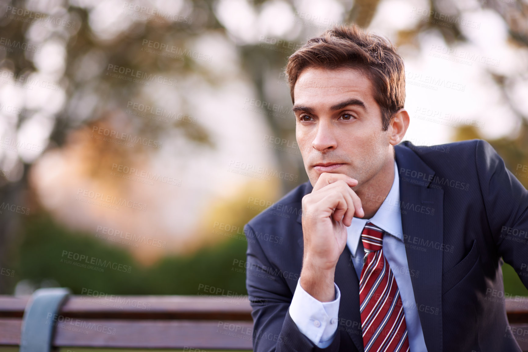 Buy stock photo Thinking, business man and professional at park bench for opportunity, dream or vision. Face, idea and lawyer outdoor with inspiration, decision making and serious employee planning future in nature