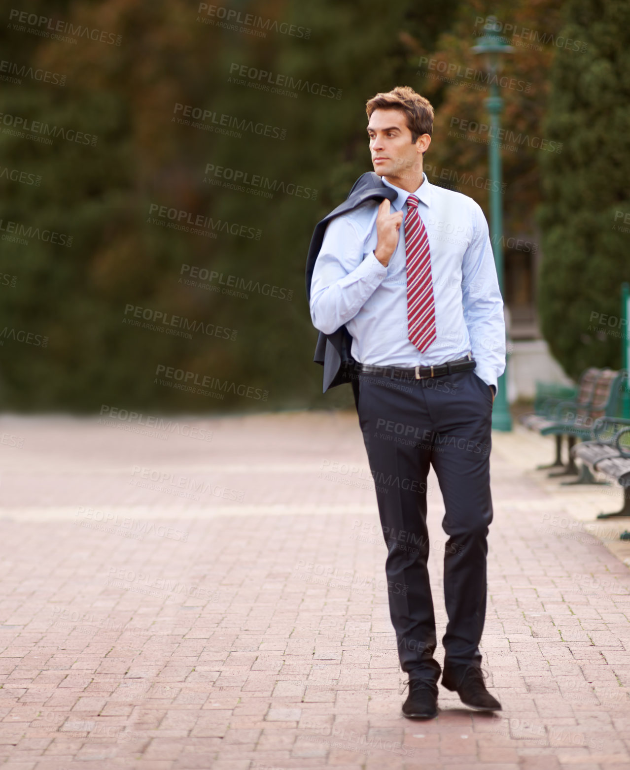 Buy stock photo Jacket over his shoulder, business and man walking, park and professional with confidence. Person, outdoor and lawyer with a suit or fresh air with pose or entrepreneur with ideas, decision or choice