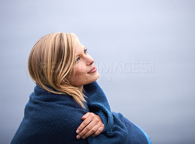 Buy stock photo Closeup, woman and outdoor with blanket for thinking with smile, wellness and contemplate for leisure. Holiday, reflect with memories in nature for happiness, relax and healthy mindset with vacation