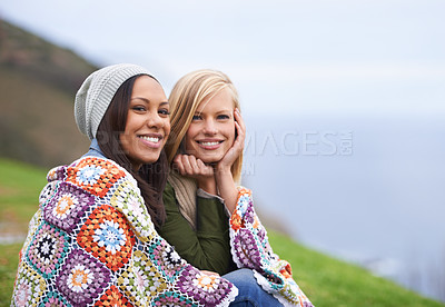 Buy stock photo Friends, mountain and portrait of women with blanket on mountain for adventure on holiday, vacation and weekend. Nature, travel and person by seaside for relaxing, outdoors and bonding in countryside