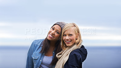Buy stock photo Friends, happy and portrait of women by ocean for adventure on holiday, vacation and weekend outdoors. Nature, travel and people by seaside for relaxing, happiness and bonding together in countryside