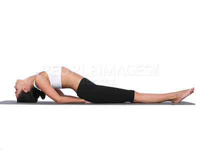 Buy stock photo A young woman doing stretches while isolated on white