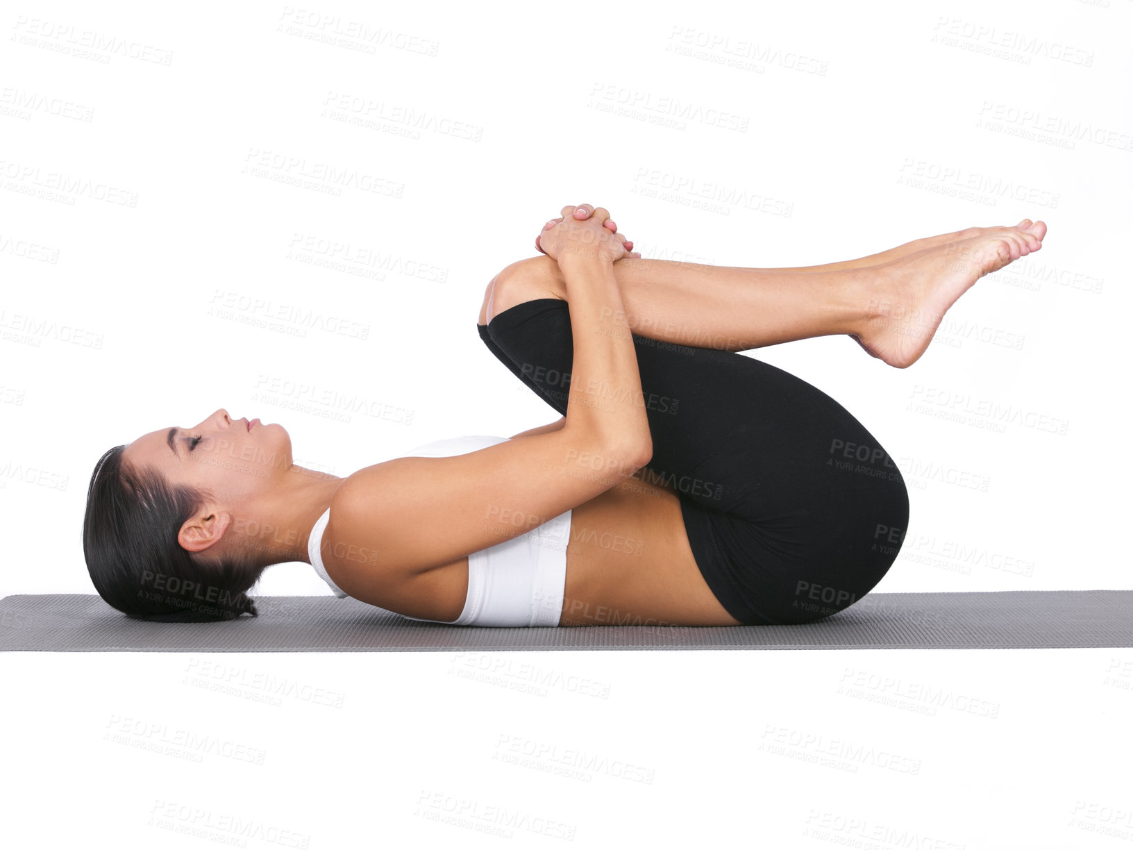 Buy stock photo Woman, yoga and stretching body for exercise, training or workout on a white studio background. Calm female person or yogi in warm up, balance or wind pose for zen, pilates or fitness on mockup space