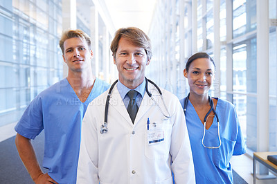 Buy stock photo A medical team standing in the hospital corridor