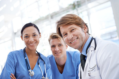 Buy stock photo Teamwork, happy and portrait of doctors in hospital for medical service, insurance and support. Professional nurses, healthcare and men and women for collaboration, consulting and medicine in clinic