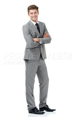 Buy stock photo A smiling young businessman standing against a white background - portrait
