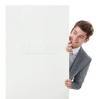 Buy stock photo Businessman, studio and happy with billboard for  information and company announcement for marketing. Entrepreneur, hiding and smile by banner for advertising and poster mockup by white background