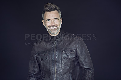 Buy stock photo Mockup, fashion and portrait of mature man in studio happy, confident and handsome against black background. Face, smile and older male model posing with space in fashionable, jacket or clothes