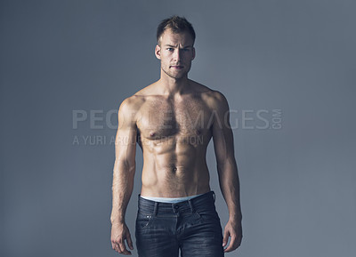 Buy stock photo Body, muscle and portrait of man with abs in studio for fashion, wellness and attitude against grey background. Sixpack, face and muscular male fitness model posing topless with confidence or style