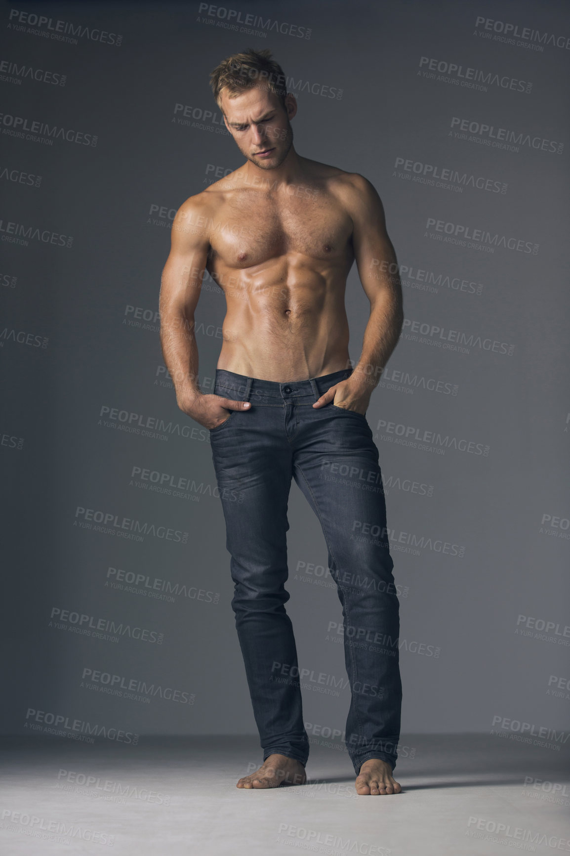 Buy stock photo Muscle, thinking and man with fitness, health and confident guy against a grey studio background. Ideas, male person or bodybuilder with wellness, athlete or training with exercise, jeans or decision