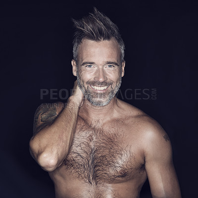 Buy stock photo Portrait, sexy and mature man with a smile, shirtless and confident guy against a dark studio background. Face, male person and model with muscle, fitness and happiness with seduction and wellness