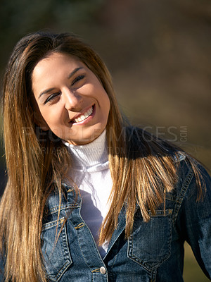 Buy stock photo Shot of a beautiful young woman enjoying a day outdoors