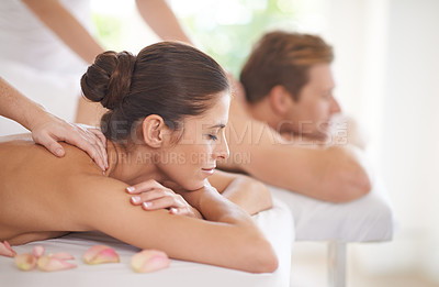 Buy stock photo A husband and wife lying together on massage tables