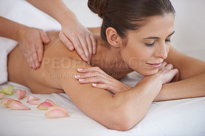 Buy stock photo Hands, massage and woman at spa to relax, peace and calm for aromatherapy with organic flowers. Eyes closed, therapy and person at salon to pamper body, skincare and natural beauty treatment for back
