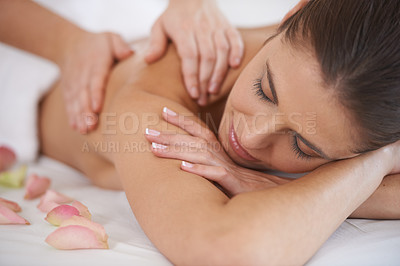 Buy stock photo Hands, massage and woman at spa to relax, peace and calm at luxury resort for aromatherapy with flowers. Closeup, therapy and person at salon to pamper body, skincare and beauty treatment for health