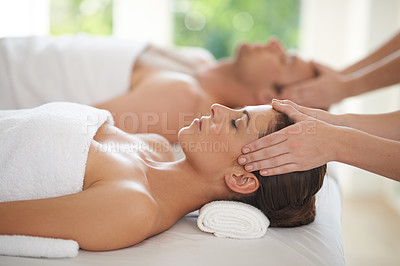 Buy stock photo Closeup shot of a young woman and her husband receiving head massages at a spa