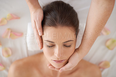 Buy stock photo Hands, top view and face massage of woman at spa to relax, peace or calm for aromatherapy with organic flowers. Above, therapy and person at salon for facial treatment, skincare and natural beauty