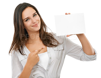 Buy stock photo Woman pointing to mockup poster for advertising, marketing or branding sign on isolated white background. Studio portrait of a model hand holding paper or card with empty space for design mock up