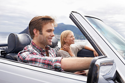 Buy stock photo Couple, convertible and driving on mountain road in nature for bonding adventure for holiday, journey or travel. Man, woman and car in California for vacation destination or connection, trip or view