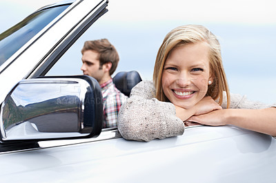 Buy stock photo Woman, portrait and man driving convertible for travel adventure for vacation, road trip or holiday. Couple, relax and transportation with smile in California for weekend journey, together or bonding