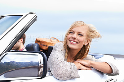Buy stock photo Woman, smile and man driving convertible for travel adventure for vacation, road trip or holiday. Couple, relax and transportation for dating in California for weekend journey, together or bonding