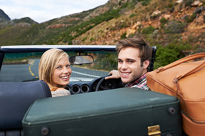 Buy stock photo Suitcases, driving and portrait of couple in a car for travel to vacation, adventure or holiday destination. Happy, love and young man and woman on journey in vehicle for weekend road trip together.